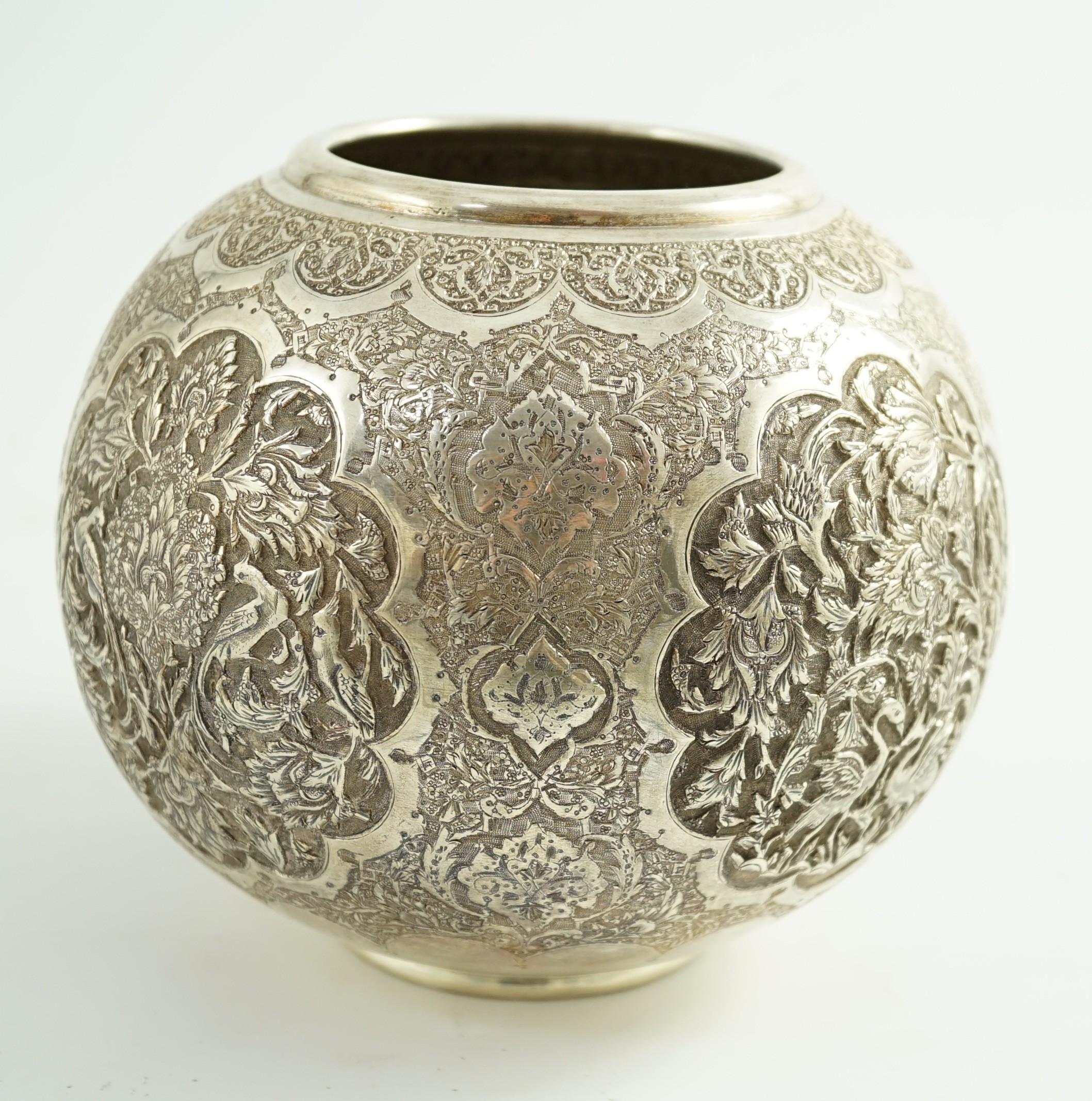 A 20th century Persian 84 standard embossed and engraved white metal vase, height 14cm, 17.4oz.